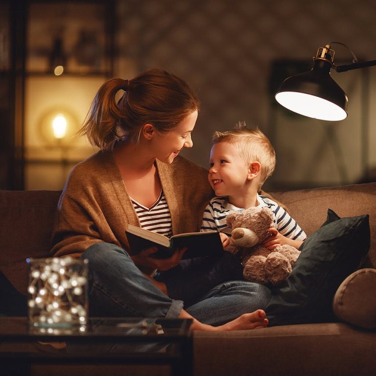 mother reading book to son